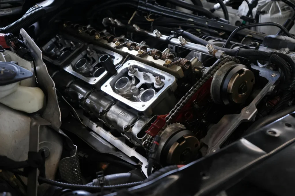 Petugas QC mengukur dimensi komponen hasil metal stamping di pabrik PT NBS Cikarang.